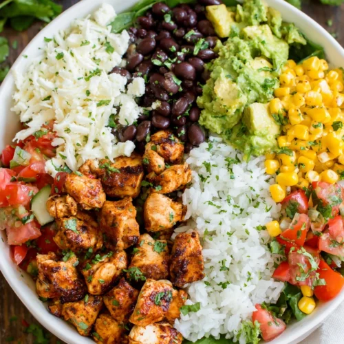Chicken Burrito Bowl: A Quick and Delicious Family Favorite 1 Chicken burrito bowl with chicken, beans, corn, and avocado.