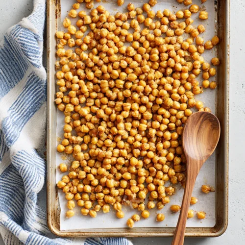 Crispy Roasted Chickpeas: A Delightfully Healthy Snack 1 Crispy roasted chickpeas on a baking sheet for snacking