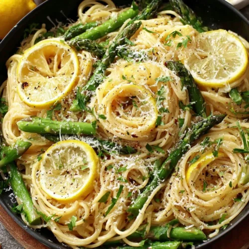 Lemon Asparagus Pasta: A Bright and Flavorful Weeknight Dinner 1 Lemon asparagus pasta dish with lemon slices and Parmesan.