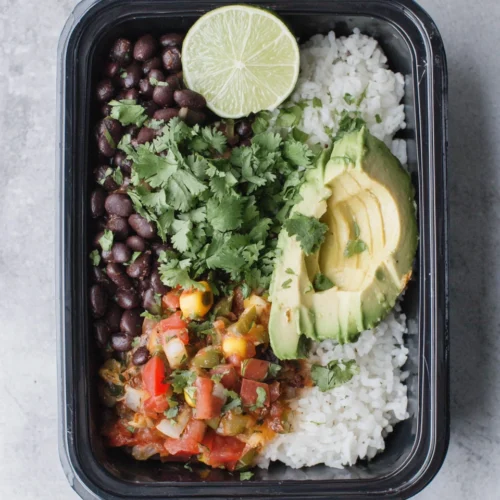 Rice and Beans Meal Prep: Simple and Flavorful 1 Rice and beans meal prep bowl with fresh toppings.