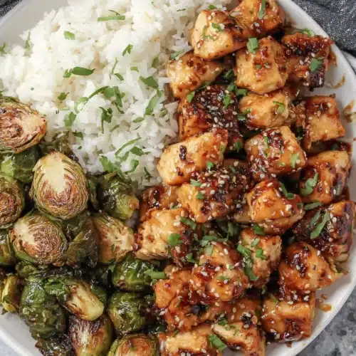 Air Fryer Sweet Chili Chicken and Brussels Sprouts: Irresistibly Delicious 1 Air fryer sweet chili chicken with Brussels sprouts and rice dish