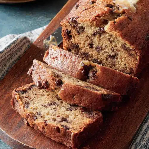 Delicious Banana Chocolate Chip Bread: A Family Favorite 1 Delicious banana chocolate chip bread with melted butter.