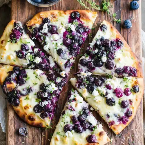 Blueberry Pizza Dessert: An Indulgent Treat for Everyone 1 Blueberry pizza dessert featuring naan, cheeses, and blueberries.