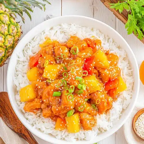 Hawaiian Pineapple Chicken: A Delicious Weeknight Winner 1 Hawaiian pineapple chicken served over rice, featuring vibrant colors.