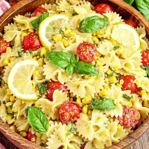 Lemon basil pasta salad with cherry tomatoes and corn.
