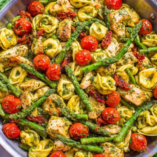 Pesto Chicken Tortellini: A Flavorful Family Favorite 1 Pesto chicken tortellini with chicken, veggies, and tortellini.