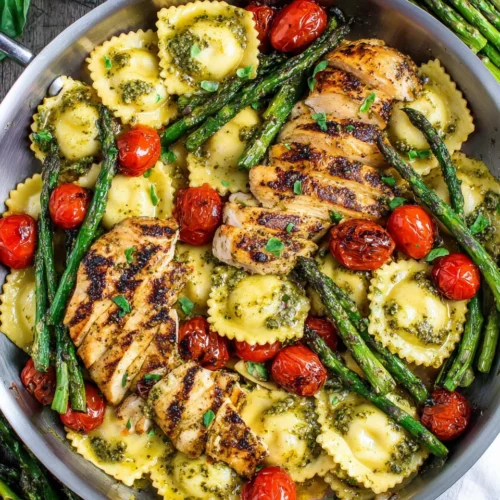 Pesto Ravioli: A Savory Weeknight Delight 1 Pesto ravioli with chicken and vegetables for a quick dinner.