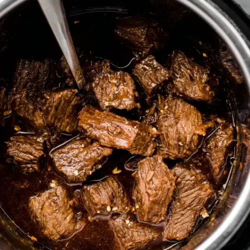 Beef Barbacoa: A Savory Family Favorite 1 Delicious beef barbacoa simmering in a savory sauce
