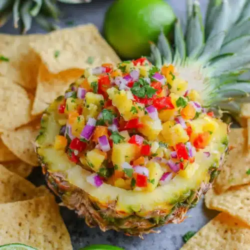 Cinco de Mayo Party Food: Delightful Pineapple Salsa 1 Pineapple salsa served in a pineapple bowl for Cinco de Mayo.