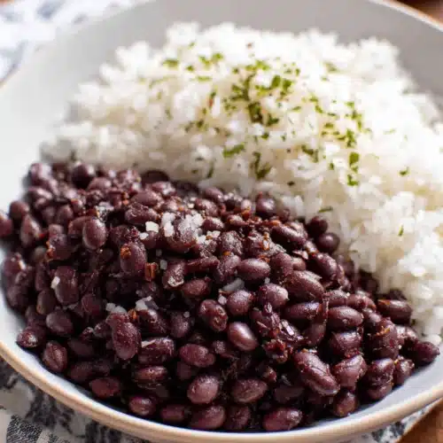 Seasoned Vegan Black Beans: Quick and Tasty Delight 1 Seasoned vegan black beans with rice, healthy and flavorful dish.