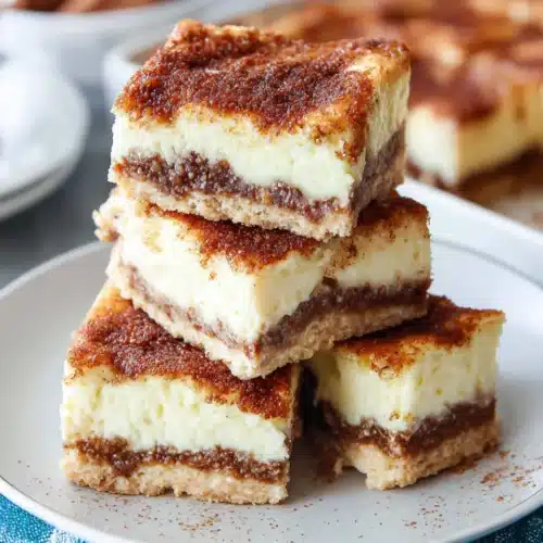 Sopapilla Cheesecake: An Irresistibly Creamy Delight 1 Delicious sopapilla cheesecake with creamy layers and cinnamon topping.