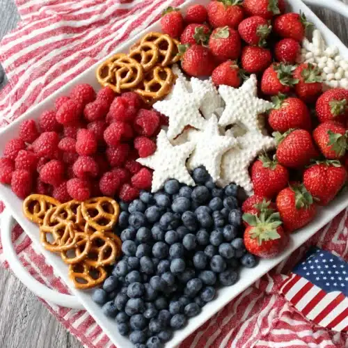 American Flag Fruit Tray: A Festive Delight! 1 American flag fruit tray with strawberries, raspberries, blueberries, and yogurt-covered pretzels