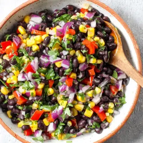 Black Bean and Corn Recipe: A Fresh, Flavorful Delight 1 Black bean and corn salad with red pepper, corn, cilantro, and lime in a bowl