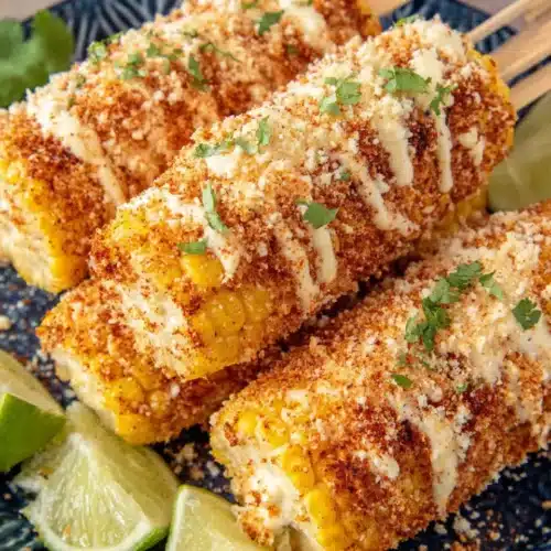 Elote Recipe: Easy and Delicious Mexican Street Corn 1 Creamy elote recipe with cotija cheese, chili powder, and lime on corn cobs