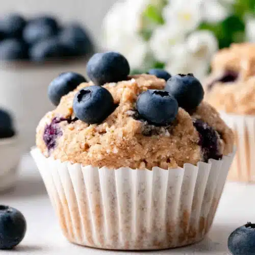 Mini blueberry banana muffin with fresh blueberries on top
