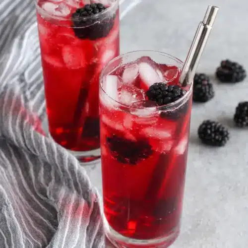 Starbucks Very Berry Hibiscus Refresher with blackberries and ice in a glass