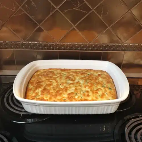 Betty Crocker Zucchini Pie: A Delicious Weeknight Dinner 2 Betty Crocker zucchini pie in a white baking dish on a stovetop