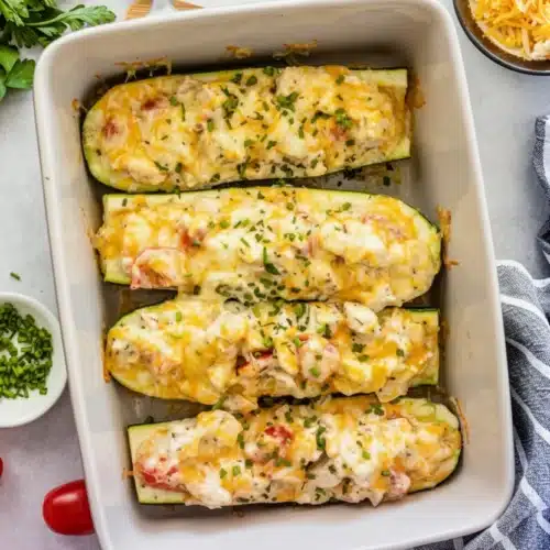 Canned Chicken and Zucchini Recipe: Easy and Delicious! 2 Canned chicken and zucchini boats with melted cheese and herbs