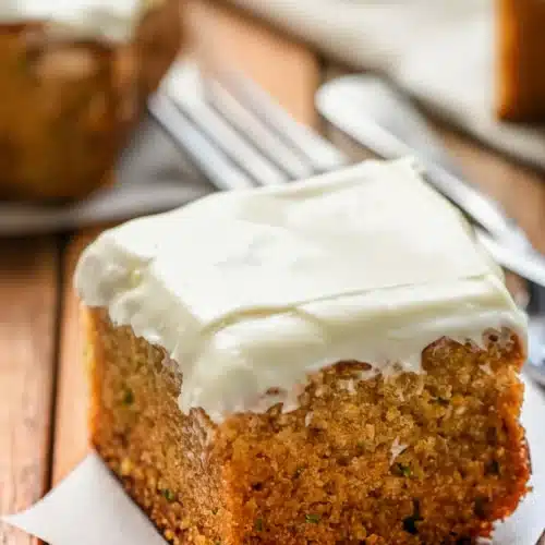 Perfect Zucchini Cake with Cream Cheese Frosting: Irresistibly Moist 2 Perfect zucchini cake with cream cheese frosting on wooden table