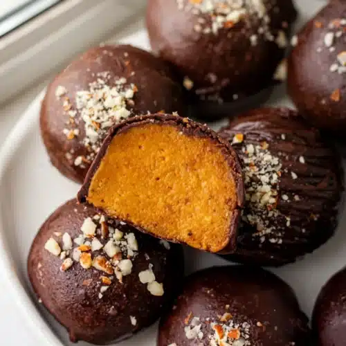 Easy Dessert Thanksgiving: Delightful Pumpkin Cookies! 1 Easy dessert thanksgiving pumpkin truffles with chocolate coating and nut topping