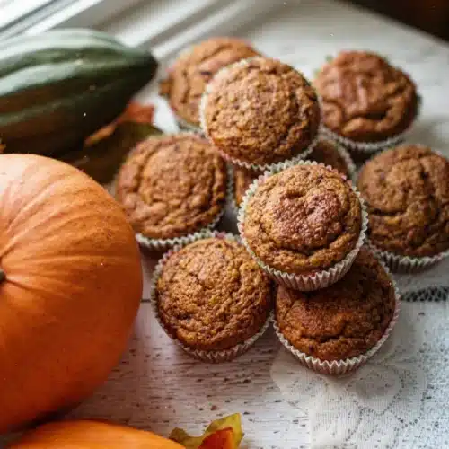 Fall Harvest Pumpkin Sourdough Muffins: A Cozy Delight 1 Fall harvest pumpkin sourdough muffins with pumpkins and autumn leaves