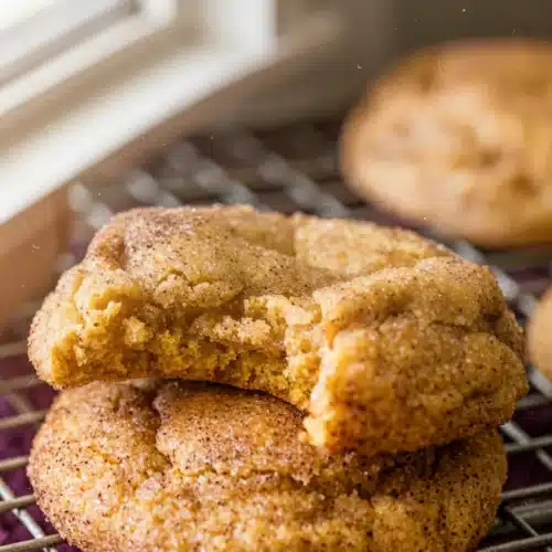 Healthy pumpkin snickerdoodle cookies on cooling rack, golden and chewy with cinnamon sugar topping